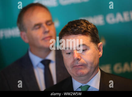 (Left-right) Minister for Education and Skills Joe McHugh and Minister for Finance Paschal Donohoe speaking to the media during the Fine Gael parliamentary meeting at the Garryvoe Hotel in Cork. Stock Photo