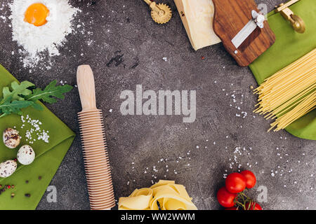 Ingredients and tools for making pasta. Space for design or recipe. Top view. Stock Photo