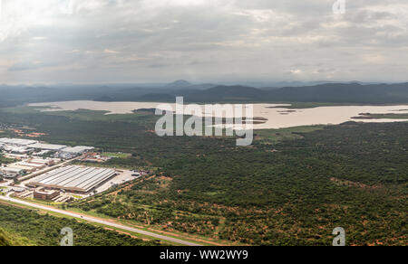 Aerial panoramic view of suburbs of Gaborone city surrounded by savannah and lake in the background, Gaborone, Botswana, Africa Stock Photo