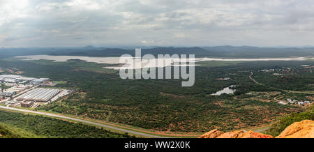 Aerial panoramic view of suburbs of Gaborone city surrounded by savannah and lake in the background, Gaborone, Botswana, Africa Stock Photo