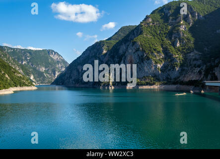 The famous Piva river canyon with its fantastic reservoir Piva Lake (Pivsko Jezero) summer view in Montenegro. Nature travel background. Stock Photo