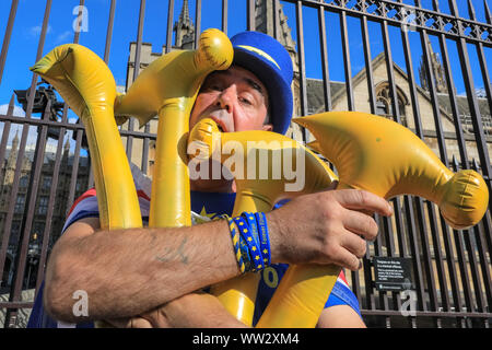 Westminster, London, 12th Sep 2019. In reference to the newly published Operation Yellowhammer Brexit preparation documents, Anti-Brexit protester Steven Bray poses with several yellow hammers outside Parliament. Credit: Imageplotter/Alamy Live News