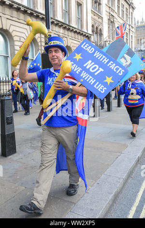 Westminster, London, 12th Sep 2019. In reference to the newly published Operation Yellowhammer Brexit preparation documents, Anti-Brexit protester Steven Bray takes several yellow hammers, along with his flags and placards, down Whitehall and to the Cabinet Office. Credit: Imageplotter/Alamy Live News Stock Photo