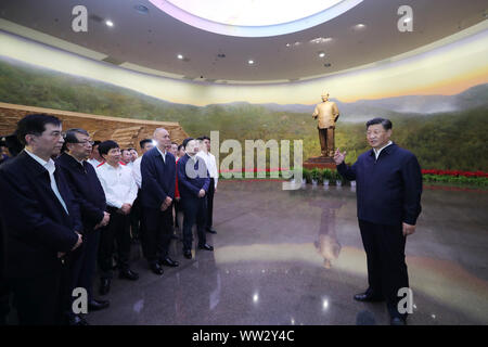 (190912) -- BEIJING, Sept. 12, 2019 (Xinhua) -- Chinese President Xi Jinping, also general secretary of the Communist Party of China (CPC) Central Committee and chairman of the Central Military Commission, delivers a speech as he visits an exhibition on the history of the CPC Central Committee, watching documentaries and reliving the history of how the CPC Central Committee moved into Beijing in 1949, at a revolutionary memorial museum in the Fragrant Hills in Beijing, capital of China, Sept. 12, 2019. Xi visited a revolutionary memorial site in the Fragrant Hills in suburban Beijing on Thursd Stock Photo
