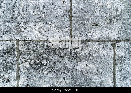 Old, damaged by time, stone wall. Natural background for designers. Stock Photo