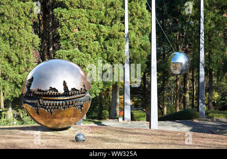 HAKONE, JAPAN - DECEMBER 01, 2007: A bronze sculpture Sfera con Sfera (sphere within a sphere) by Arnaldo Pomodoro in the Hakone Open Air Museum at au Stock Photo