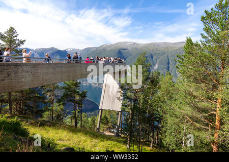 People looking at Aurlandsfjord from the top of Stegastein viewpoint platform, a modern architecture lookout with maje Stock Photo