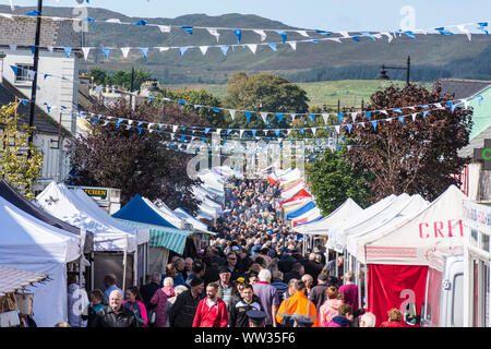 Glenties, County Donegal, Ireland. 12th September 2019. Crowds walk the main street in the small town during the annual Harvest Fair. The fair is the biggest of it's kind in Ireland and the main N56 road through the town is closed for the day with diversions in place. Stock Photo