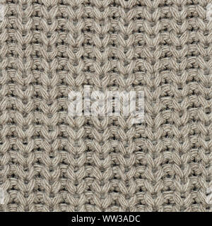 The texture of the knit fabric is beige. Close-up. Abstract background Stock Photo
