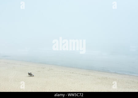 Senior couple enjoy the waterfront view from Long Nook Beach, Truro, Cape Cod, Massachusetts, USA. Stock Photo