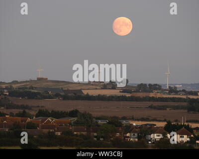 Halfway Houses, Sheerness, Kent, UK. 12th September, 2019. UK Weather: the 98% waxing gibbous moon rising over farmland on the Isle of Sheppey in Kent as seen from Halway Houses, Sheerness. Tomorrow will see a full moon - the first on Friday 13th for a number of years. The September full moon is known as the Harvest Moon. Credit: James Bell/Alamy Live News Stock Photo