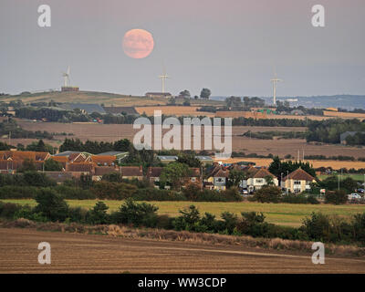 Halfway Houses, Sheerness, Kent, UK. 12th September, 2019. UK Weather: the 98% waxing gibbous moon rising over farmland on the Isle of Sheppey in Kent as seen from Halway Houses, Sheerness. Tomorrow will see a full moon - the first on Friday 13th for a number of years. The September full moon is known as the Harvest Moon. Credit: James Bell/Alamy Live News Stock Photo