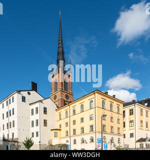 Stockholm, Sweden. September 2019.  view of the bell tower of the  Riddarholmen church among the old houses of Gamla Stan island Stock Photo