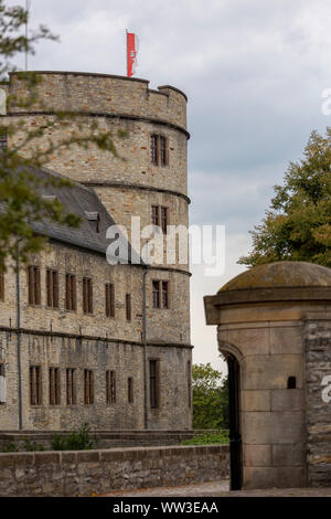 Entrance and main portal into the Wewelburg castle with the large round tower in the background Stock Photo