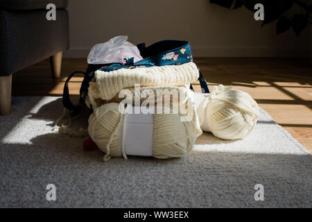 knitting wool on the floor at home Stock Photo