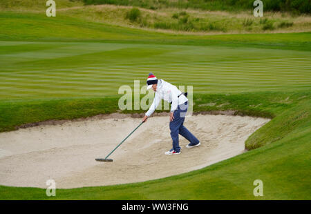 Auchterarder, Scotland, UK. 12th Sep, 2019. Final practice day at 2019 Solheim Cup on Centenary Course at Gleneagles. Pictured; Juli Inkster, team Captain of USA rakes bunker. Credit: Iain Masterton/Alamy Live News Stock Photo