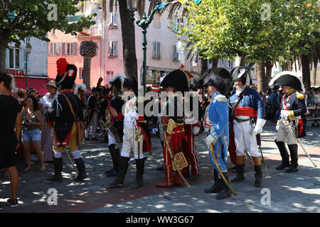 The reenactors dressed as Napoleon epoch soldiers for celebration the Napoleon birthday who was born in Ajaccio 250 years ago. Stock Photo