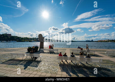 Stockholm, Sweden. September 2019.  some people rest in the sun on the quay on the island of Gamla Stan in the city center Stock Photo