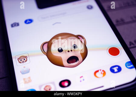 Paris, France - Sep 12, 2019: Latest iPhone 11 Pro featuring multiple Animoji character with face of monkey expressing open mouth astonished face sentiments Stock Photo