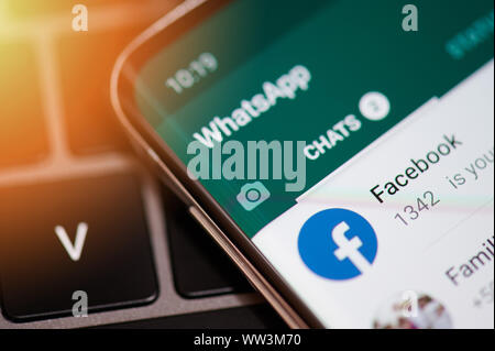 New york, USA - september 12, 2019: Whatsapp app chat with facebook in modern smartphone screen close up view Stock Photo