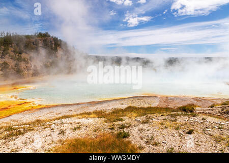 Steam rises from a pool at Grand Prismatic Spring in Yellowstone National Park. It is the largest hot spring at Yellowstone National Park with 200-330 Stock Photo