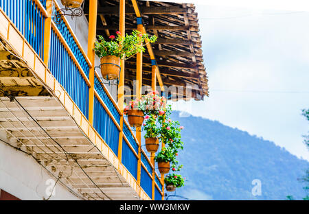 View on colorful balcony in front of colonial buildings of Jardin, Colombia Stock Photo