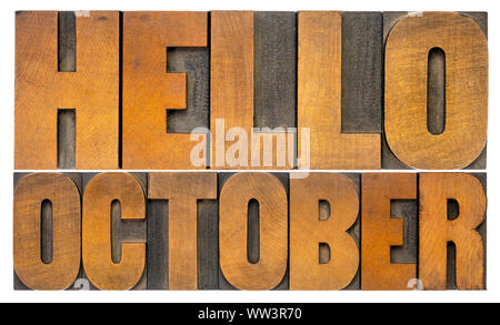 Hello October - cheerful word abstract in vintage letterpress wood type blocks isolated on white, Stock Photo