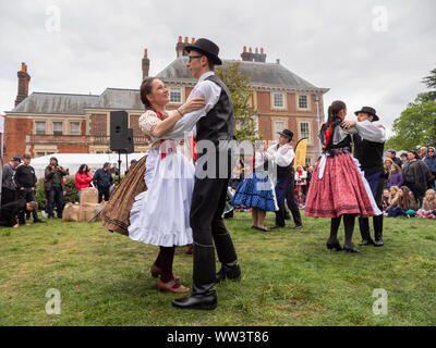 Couples in traditional Bulgarian folk costumes dancing at a Bulgarian festival at Forty Hall, Enfield, London, UK Stock Photo