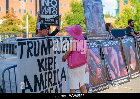 Houston, Texas - September 12, 2019: Small group of Trump supporters and anti-abortion activists protest outside Democratic primary debate venue near Stock Photo