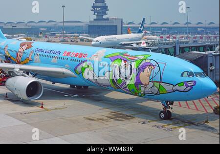 HONG KONG -18 JUL 2019- View of an Airbus A330 airplane from China Eastern Airlines (MU) painted in a Toy Story special livery at the busy Hong Kong I Stock Photo