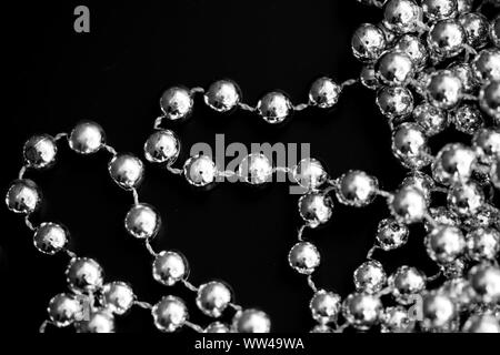 Christmas decoration on a dark surface close up black and white. Abstract background Stock Photo