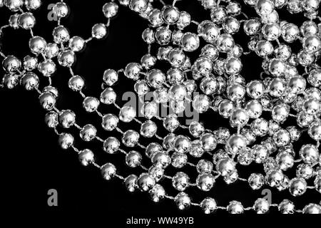 Christmas decoration on a dark surface close up black and white. Abstract background Stock Photo