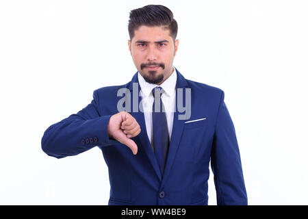 Stressed bearded Persian businessman giving thumbs down Stock Photo