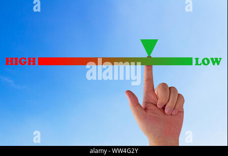 Risk assessment, management planning concept, hand and level bar on blue background Stock Photo