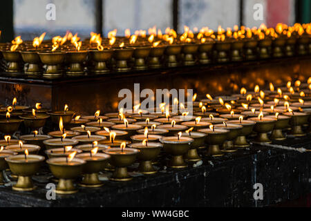 Prayer lamps inside the Rumtek Monastery in the city of Gangtok in the state of Sikkim in India Stock Photo