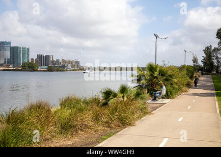 Meadowbank in Sydney, Memorial Park beside the Parramatta river, wentworth point suburb in the distance,Sydney,Australia Stock Photo