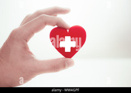 Hospital Health Care Love with Heart in Hand for Help and Donation concept Stock Photo