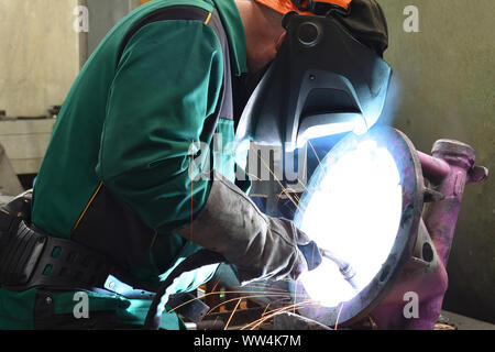 welder at work in an industrial company Stock Photo