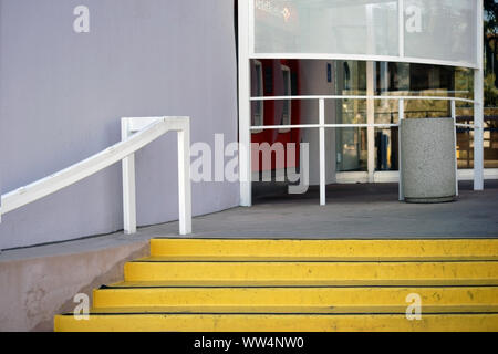 A bank entrance with stairs and cash dispensers beside the front door, Stock Photo