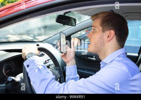 Driver Had Almost Accident While Using Phone While Driving Car Stock Photo
