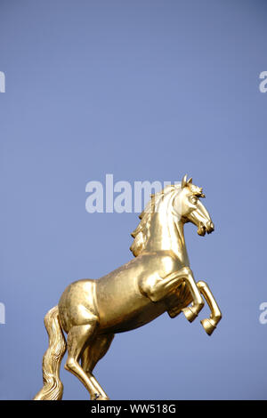 Mainz, Germany, golden horse sculpture on the roof of the Landesmuseum Mainz in the sunlight Stock Photo