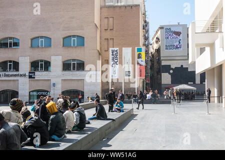 BARCELONA, SPAIN - March 21, 2019: Walkers in Los Angeles square, center of the Raval neighborhood in Barcelona, very close to the Macba Museum. On th Stock Photo