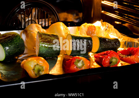 Healthy food. Pepper and zucchini with a ruddy crust are prepared in the oven. Grilled vegetables Stock Photo