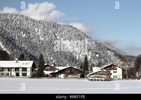 The small snow-covered village Farchant at the foot of a mountain in Upper Bavaria, Stock Photo
