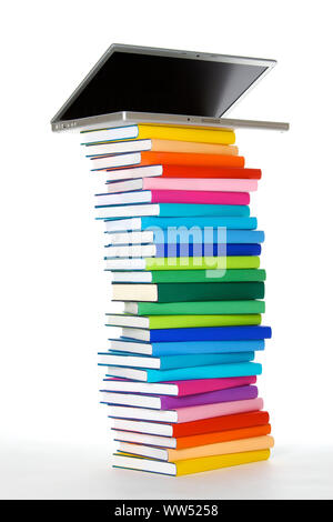 Laptop on book stack, side view Stock Photo