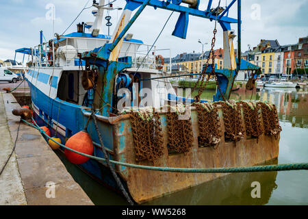 Rusty boat and nets for catching scallops Stock Photo