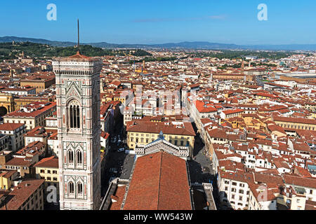 giotto’s campanile bell tower and the rooftops of the city of flornece viewed from the top of the dome on the cathedral, florence, tuscany, italy.