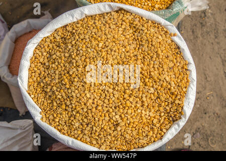 Burlap, Bag full of Arhar or masoor Dhal or Toor Dal Pigeon Pea. concept for earnings or spend in Agriculture.