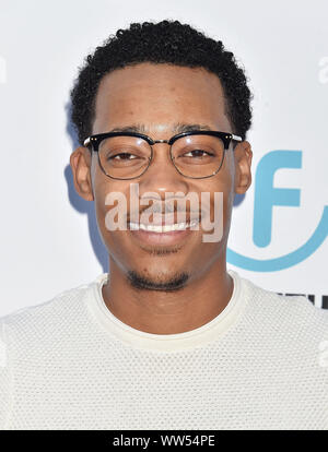 HOLLYWOOD, CA - SEPTEMBER 12: Tyler James Williams (L) and Sarah Hyland