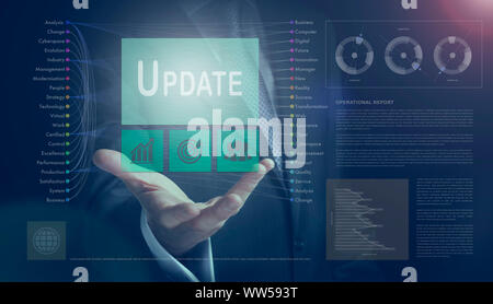 Businessman outreached hand holding a Update business concept on a computerised screen display. Stock Photo